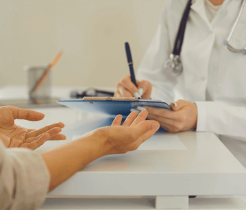 The doctor giving prescription to patient in NewLife Fertility center